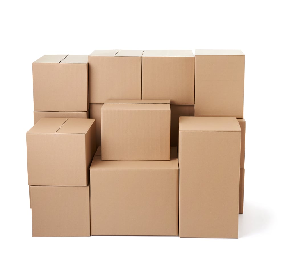 close up of a stack of cardboard boxes on white background