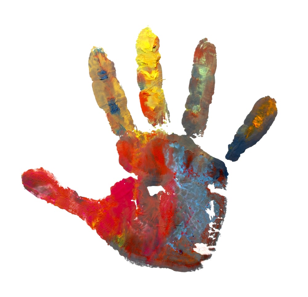 close up of child  hands painted with watercolors mark on white background
